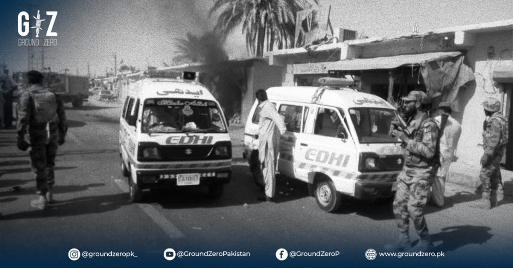 Police and bomb disposal squad at the scene of the Turbat bank explosion.