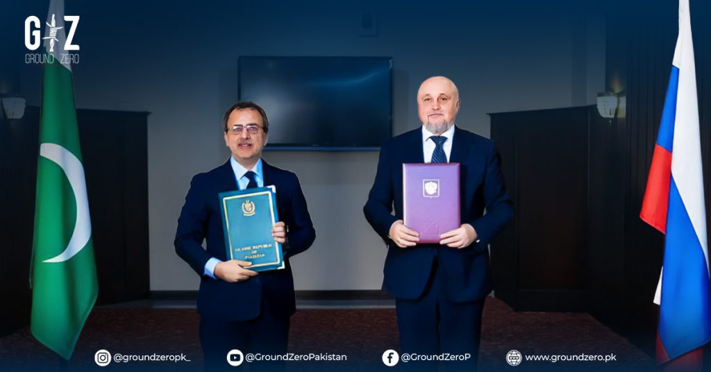 Pakistani and Russian officials exchanging MoU documents at the signing ceremony